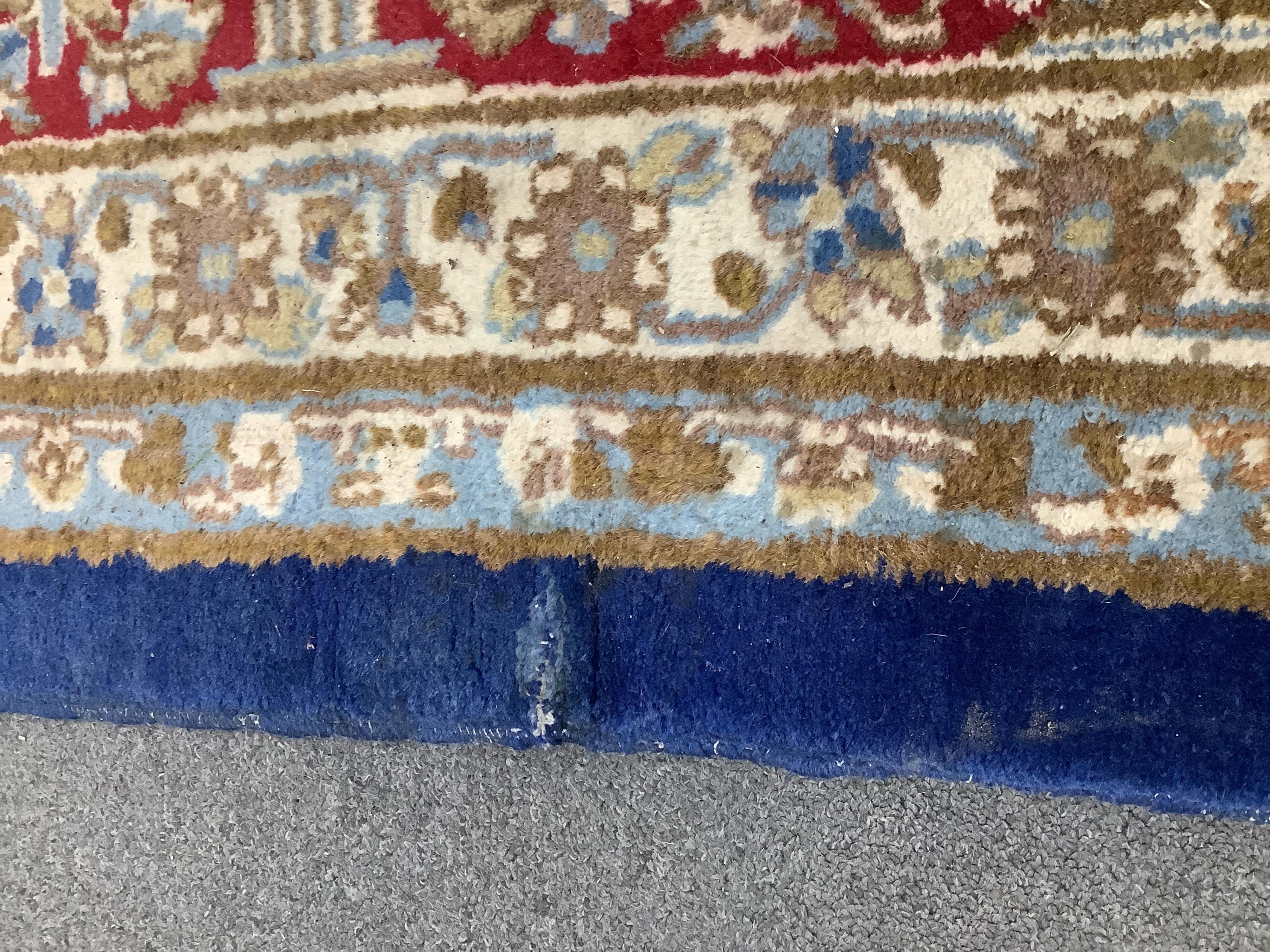 A North West Persian blue ground carpet, 394 x 284cm. Condition - good